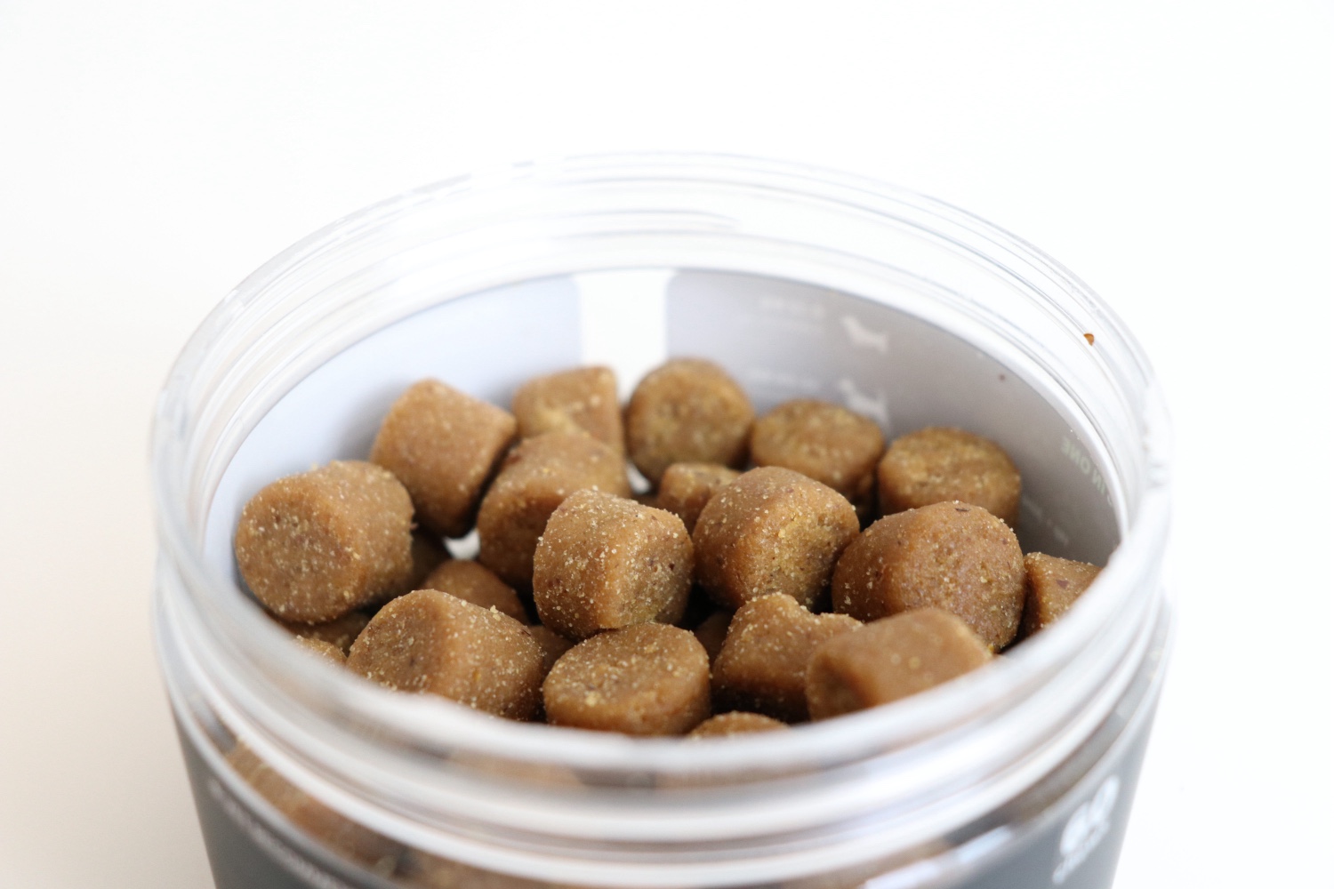 Close-up of the open VitalPaws jar showing the duck-flavoured soft chews